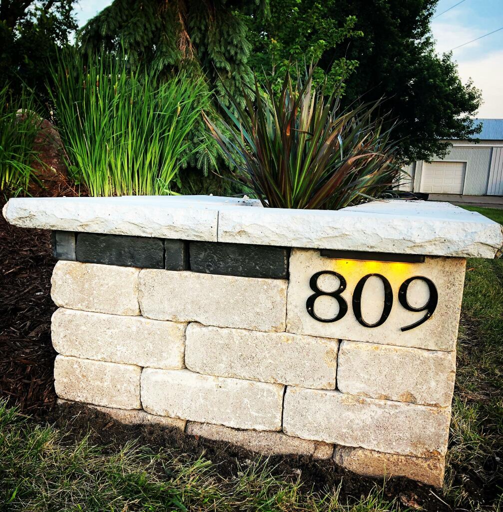 Unilock Planter and address retaining wall by Sequoia Landscape