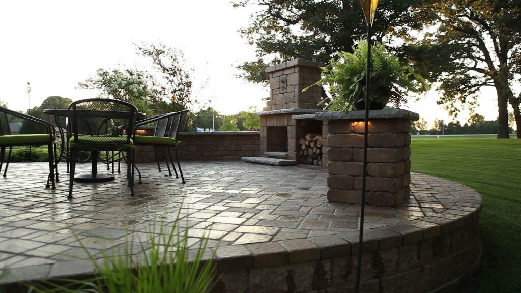 Outdoor Dining Area With Fireplace by Sequoia Landscape